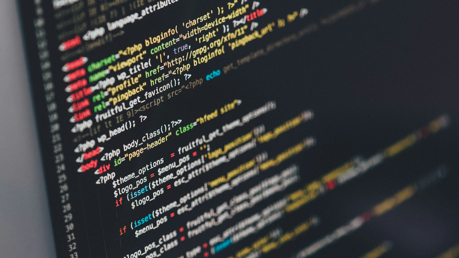 Code on a monitor in a dark room
