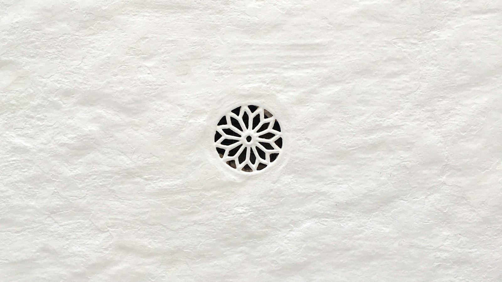 Geometric pattern carved into white paper